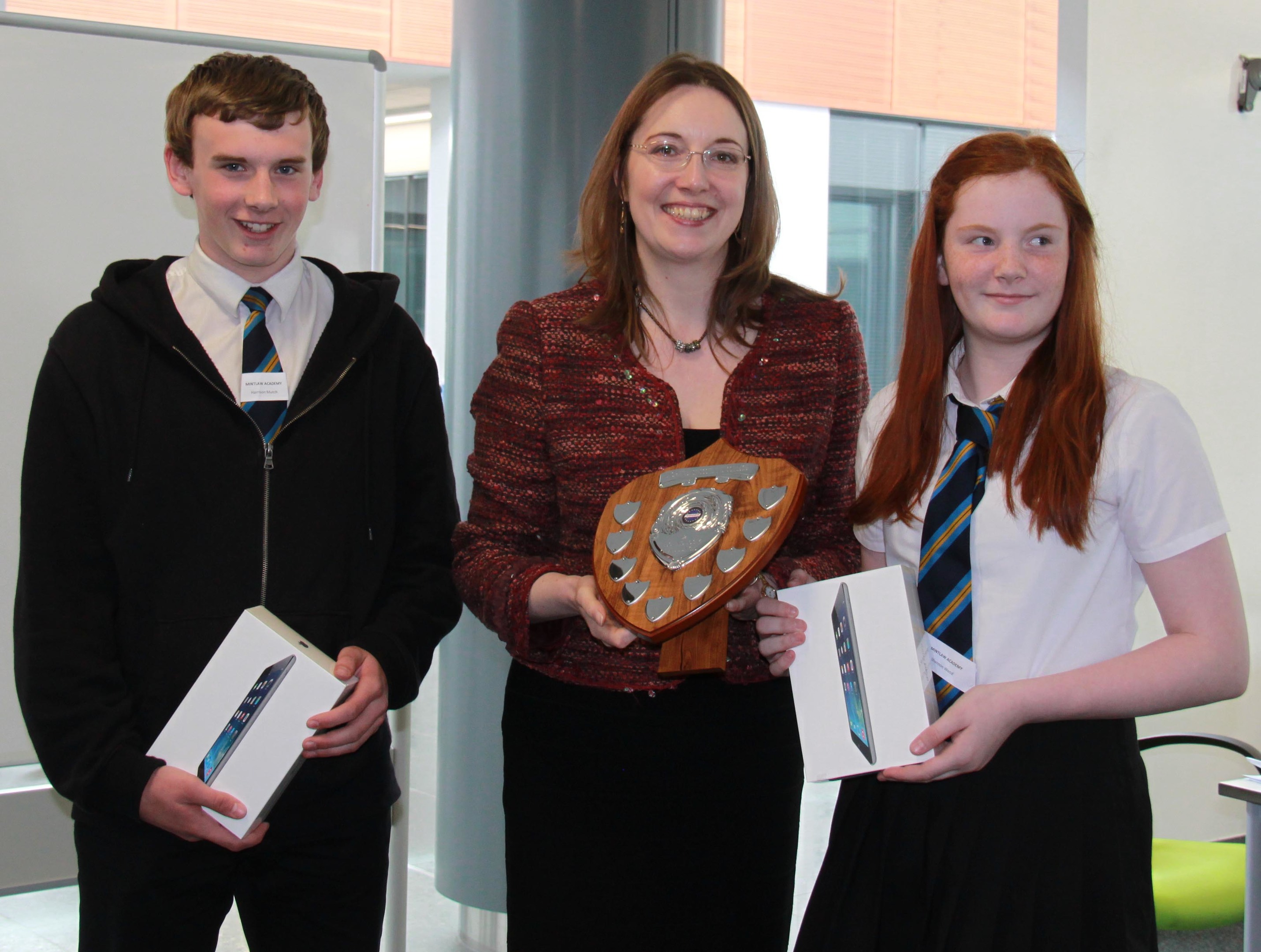 Harrison Mutch and Shannon Wood of Mintlaw Academy collect their prizes from MP Eilidh Whiteford.