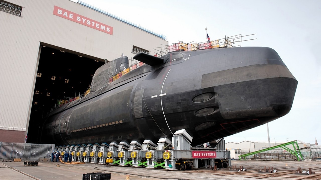 Astute class submarine Artful, designed and built by BAE Systems for the Royal Navy, as it rolls out of the Devonshire Dock Hall in Barrow-in-Furness, Cumbria, where it was constructed