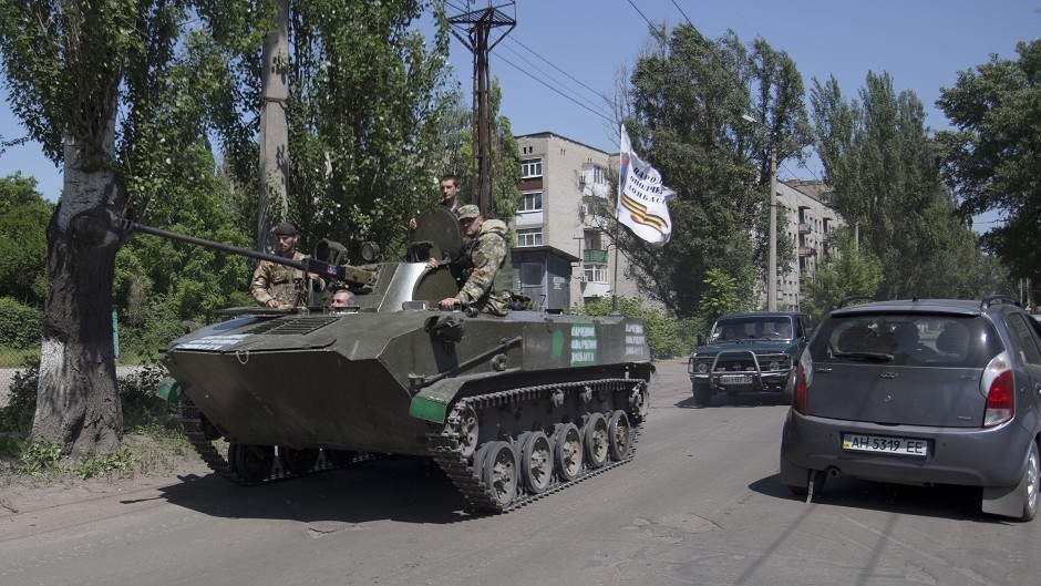 Pro-Russian militants in an armoured personal carrier guard streets in Slovyansk, eastern Ukraine. (AP Photo/Alexander Zemlianichenko, File)