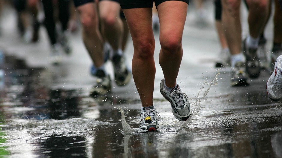 Runners making their way through puddles during the Edinburgh marathon in 2022. 