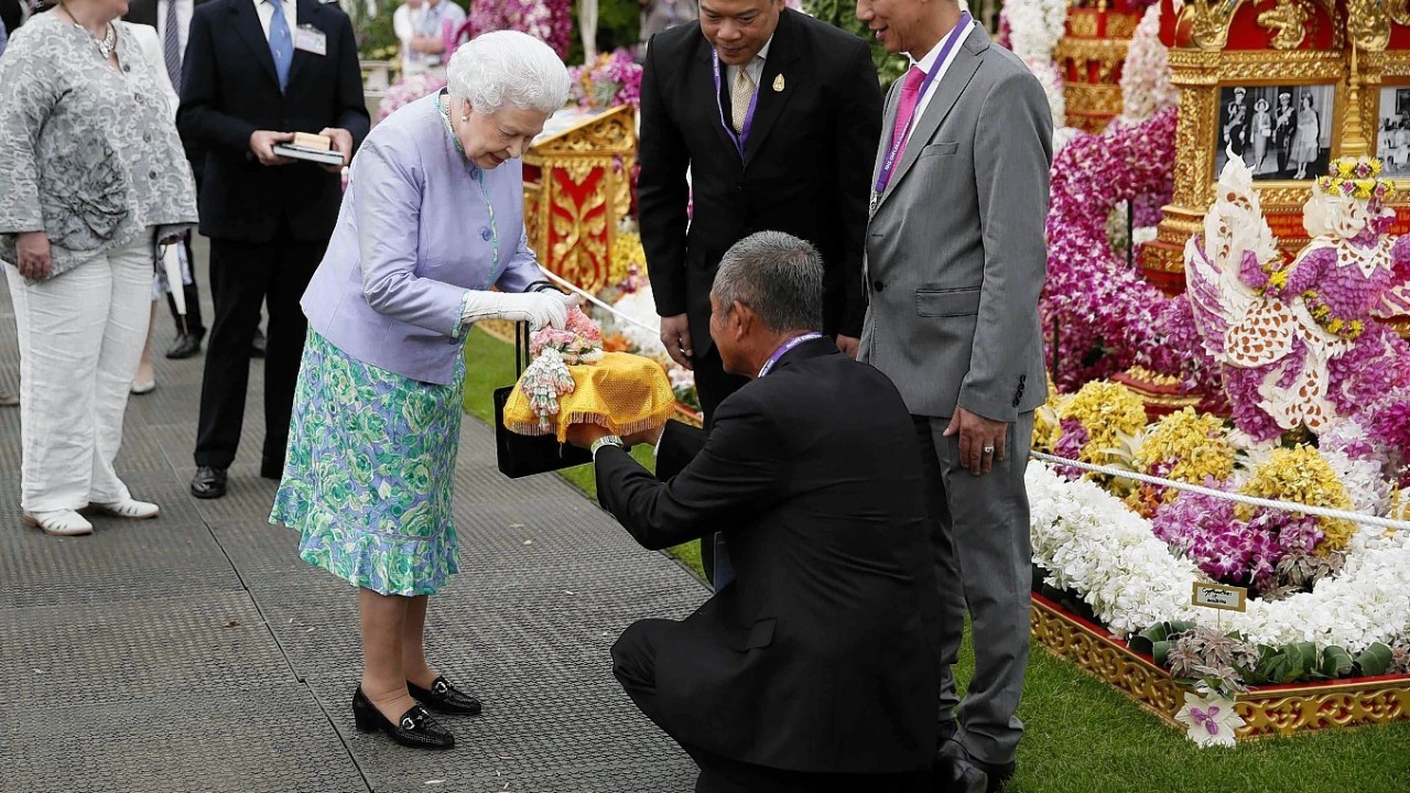 Queen Elizabeth II visits the Thai exhibit during a visit to the Chelsea Flower Show