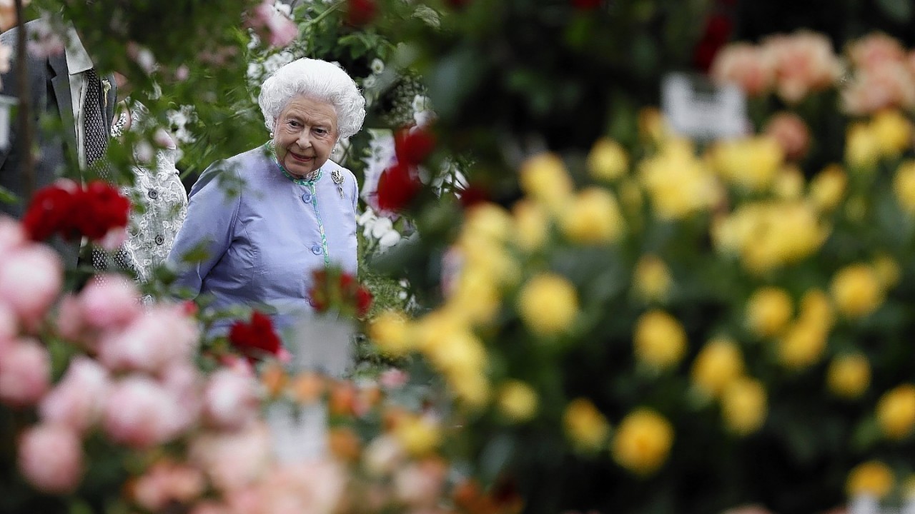Queen Elizabeth II looks at a display during a visit to the Chelsea Flower Show in London