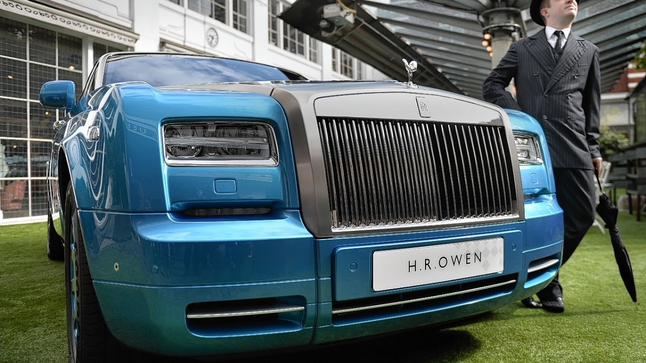 People view the new Rolls Royce Waterspeed Phantom Drophead Coupe, of which only 35 will be made, during its launch at the Bluebird Cafe, Campbell's original workshop, London
