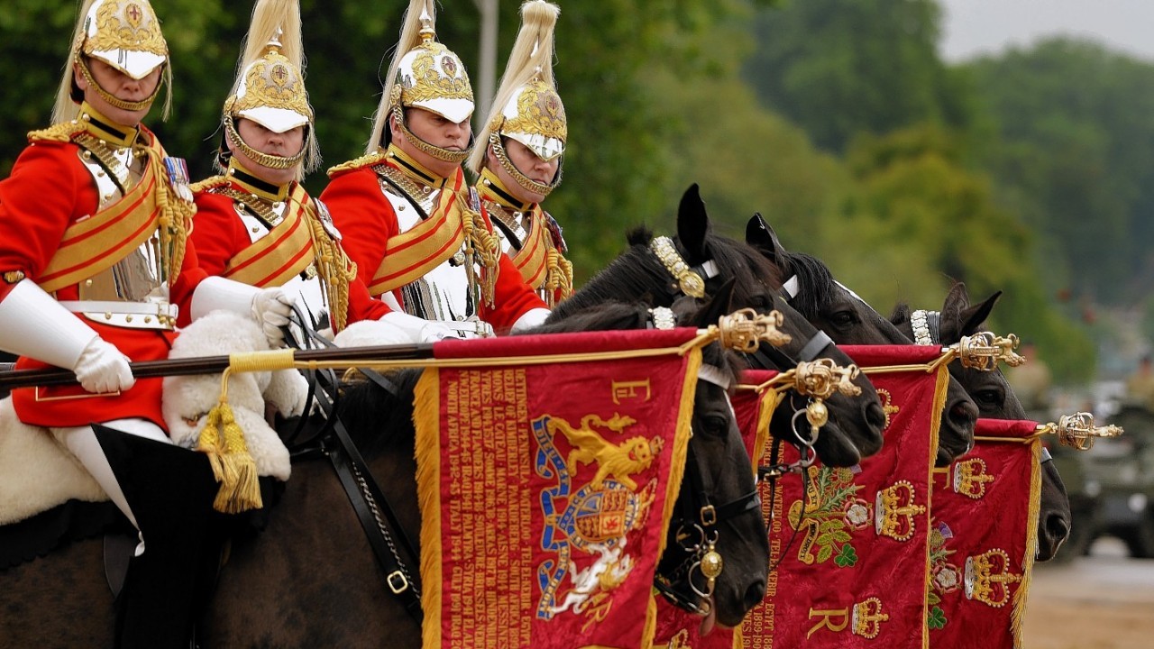 Members of the Household Cavalry after they were presented with new standards by Queen Elizabeth II at Horse Guards Parade, London.