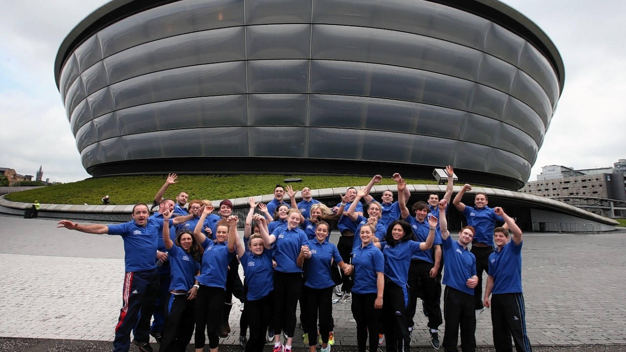 Scotland's Judo, Gymnastic and Weightlifting Athletes celebrate outsidee the Hydro Venue as they are announced as part of Team Scotlland for the Commonwealth Games during the photocall at The Hydro, Glasgow.