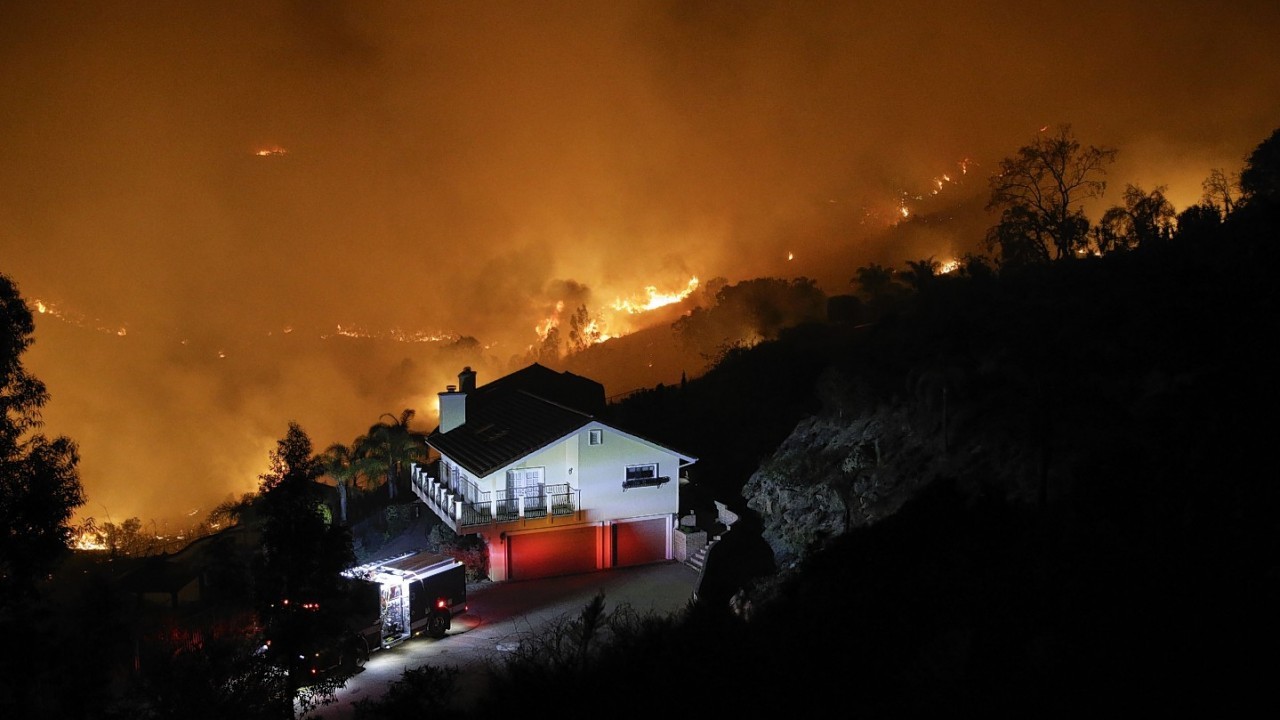 Flames engulfed suburban homes and shot up along canyon ridges in one of the worst of several blazes that broke out Wednesday in Southern California during a second day of a sweltering heat wave