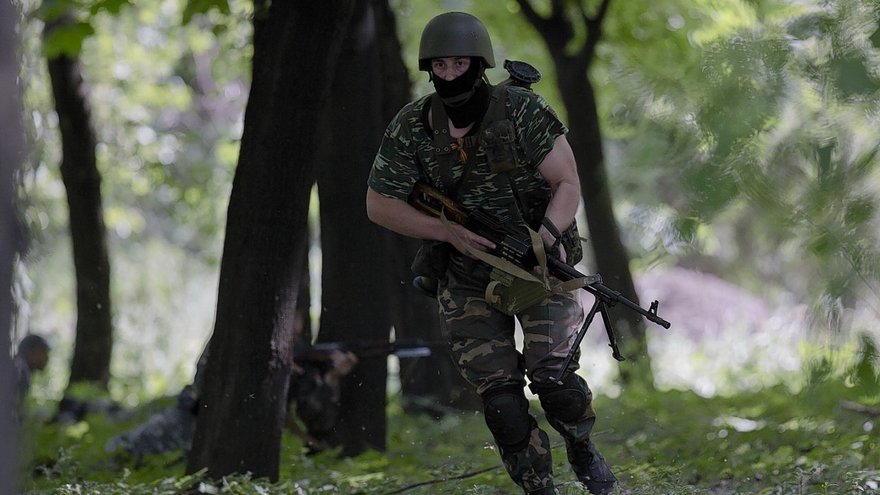 Pro-Russian gunmen take positions near the airport, outside Donetsk, Ukraine