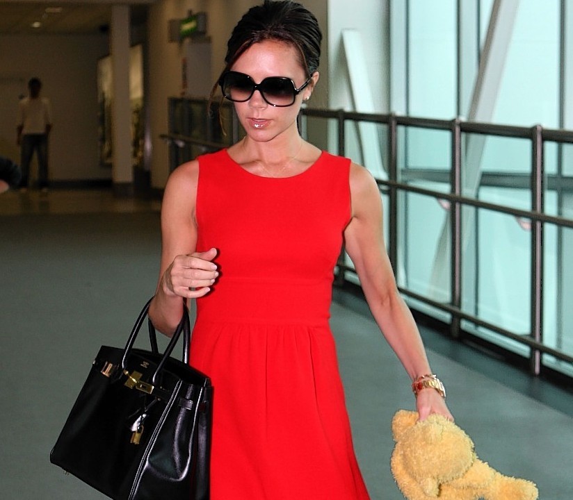 2010: Looking put-together at the airport is a skill Victoria has undeniably mastered. She stands out from weary Heathrow travellers in red shift dress, arm candy bag and oversized sunglasses to disguise the jet lag.