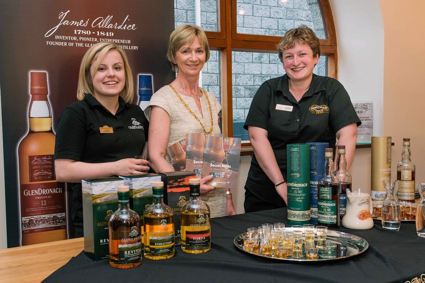 Aberdeenshire Provost Jill Webster with staff from Glendronach Distillery