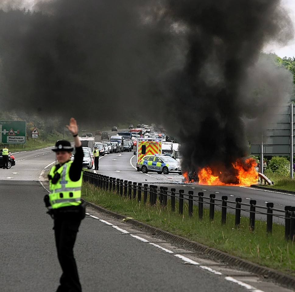 Two cars burst into flames after colliding on the A9