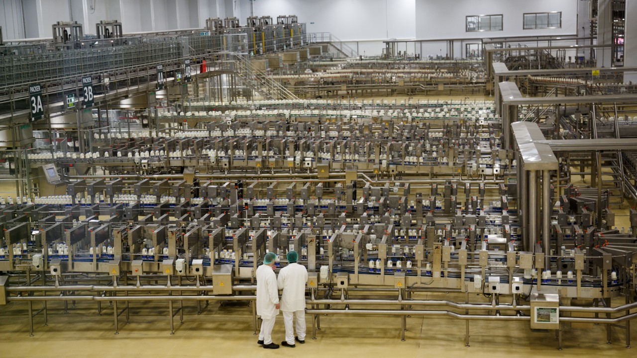 Employees at work in the filling hall on the day of the official opening of Arla Dairy, in Aylesbury.