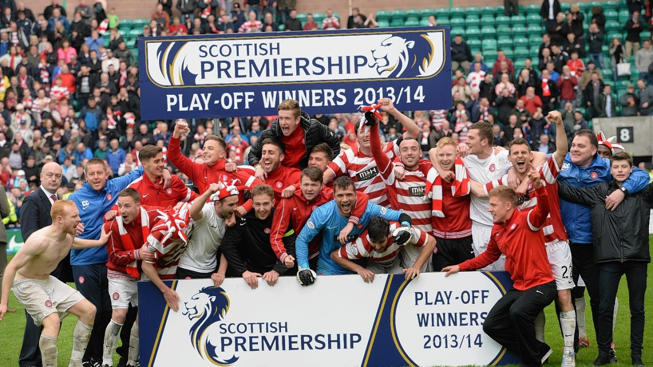 The Hamilton players and staff celebrate promotion to the Scottish Premiership