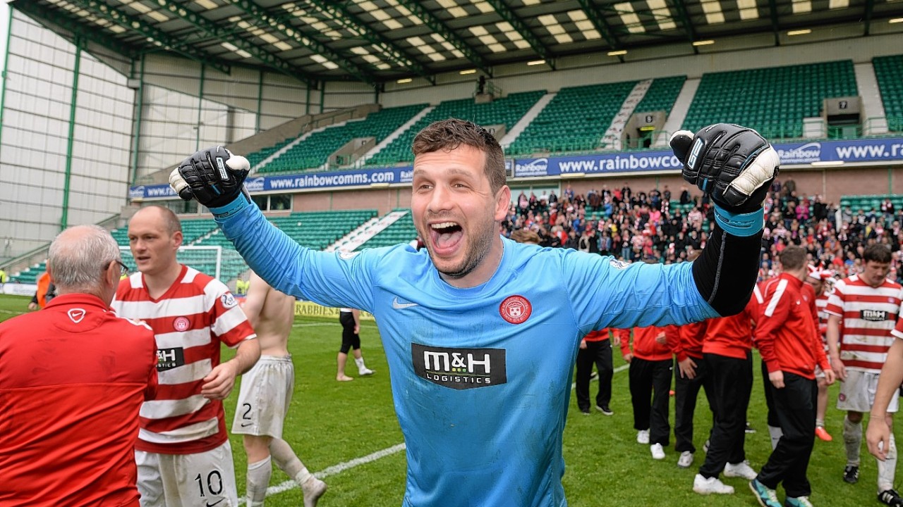 Hamilton goalkeeper Kevin Cuthbert celebrates his side's promotion.