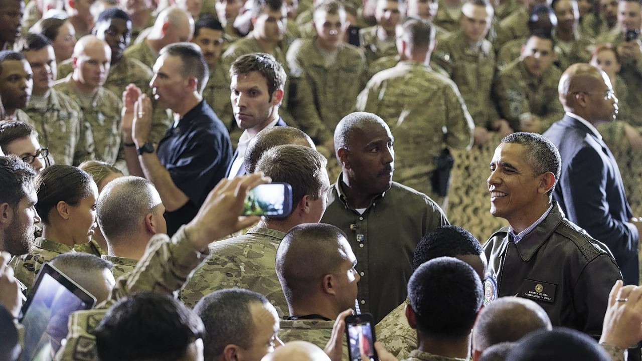 President Barack Obama greets troops at Bagram Air Field, north of Kabul, Afghanistan, during an unannounced visit on Sunday, May 25, 2014.