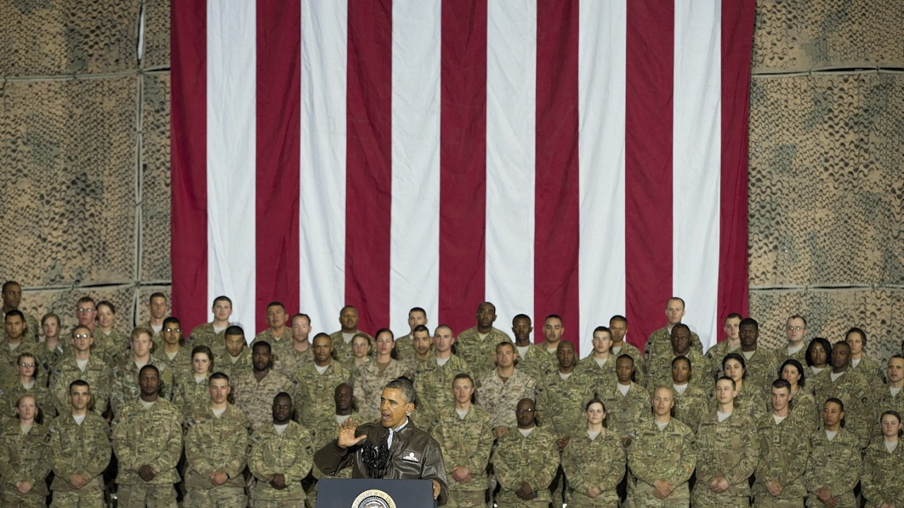 President Barack Obama gestures while speaking to troops at Bagram Air Field north of Kabul, Afghanistan, during an unannounced visit, on Sunday, May 25, 2014.