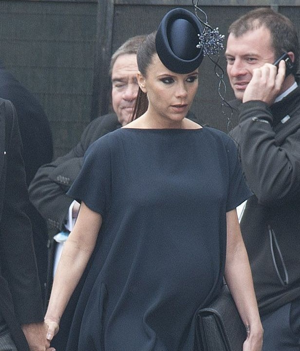2011: Victoria didn't only bag an invite to the Royal Wedding of Kate and Wills, she
successfully navigated the formal dress code while heavily pregnant with daughter Harper. She chose to wear her own navy design and pair of customised
sky-high Louboutins.