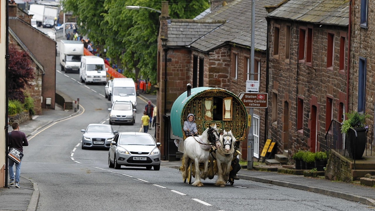 People arrive for the start of the Appleby Horse Fair, the annual gathering of gypsies and travellers in Appleby, Cumbria.