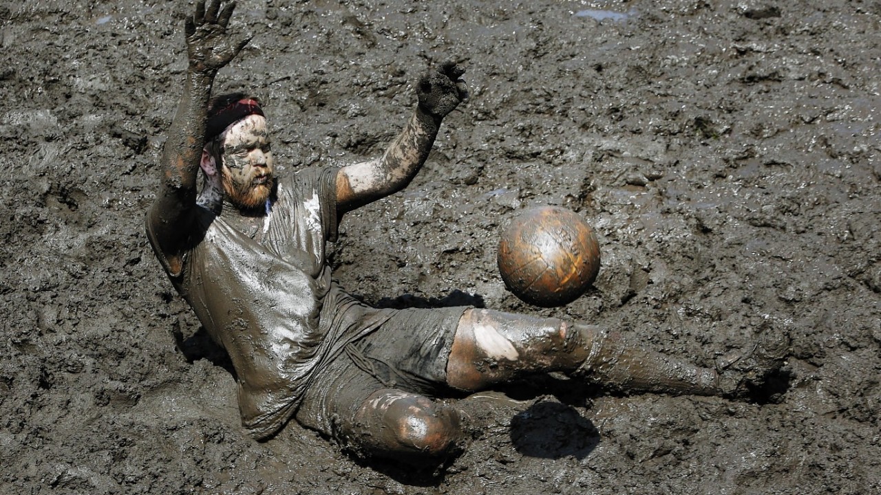 Players got knee-deep in mud on a purpose-built peat football field today in an event organised whisky maker Ardbeg