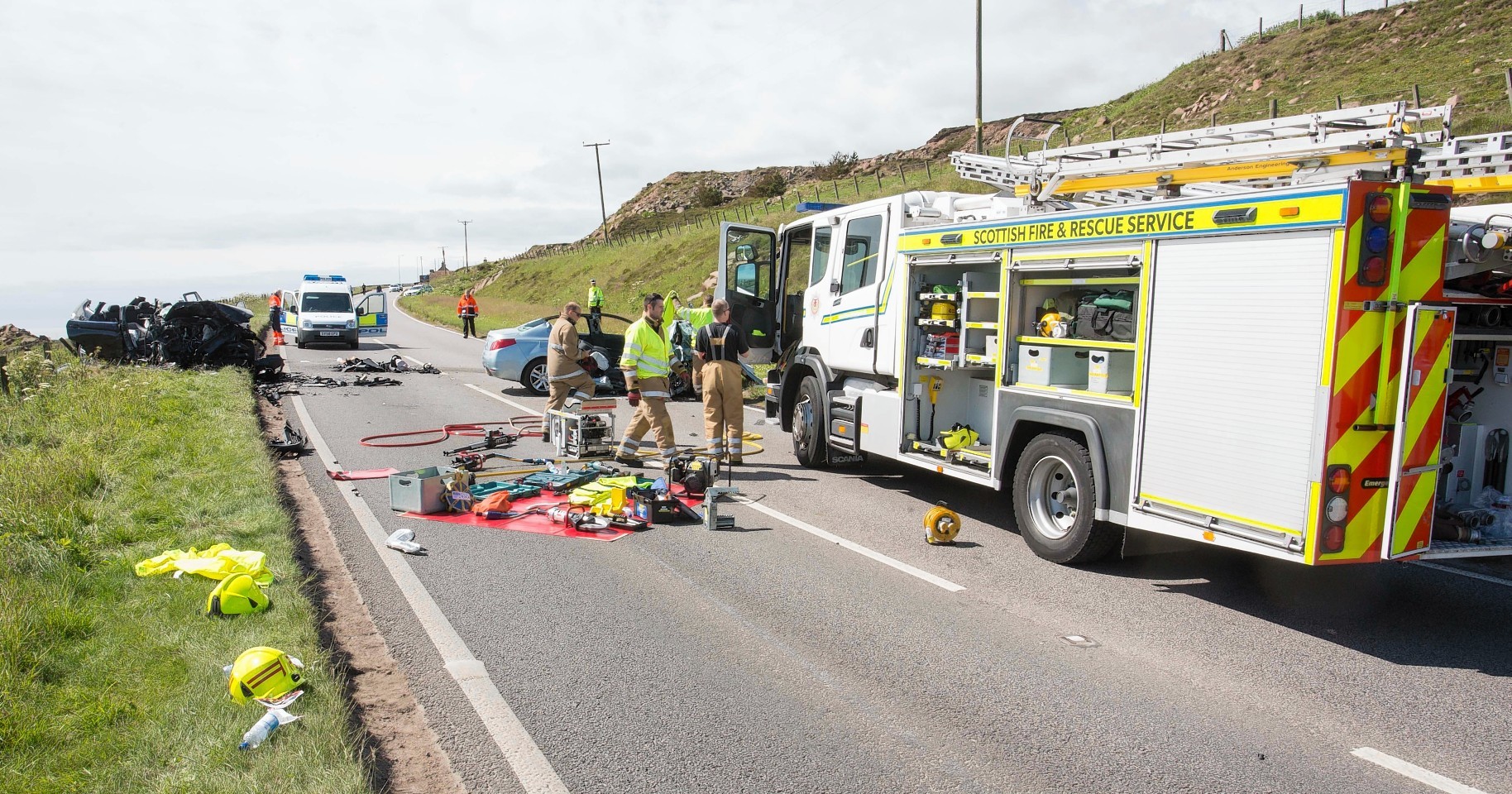 Rescue crews working at the scene of the A90 crash near Peterhead