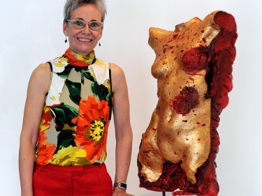 Louise Steadman next to one of the pieces of work on show in the Breathless Breastless Project