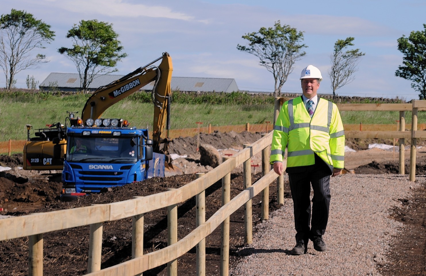 The annoncement of the prefeered bidder for the Aberdeen western peripheral route. In the picture at near Findon is Transport minister, Keith Brown.
