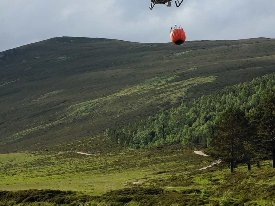 The helicopter heads west to the scene of the fire at Derry Lodge