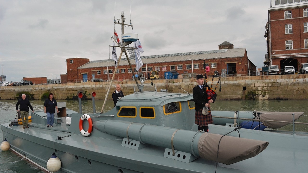 The MTB 102 - the vessel used by Churchill and Eisenhower to review the armada- as it arrives to meet veterans from the UK and US at the Portsmouth Historic Dockyard ahead of the 70th anniversary of the D-Day campaign.