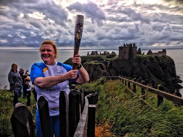 Professor Sue Black with the Baton at Dunnottar Castle