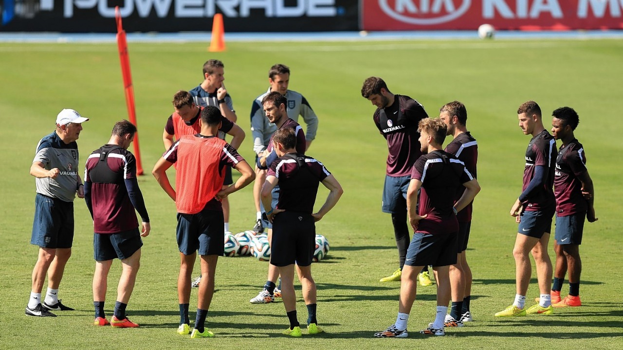 England' manager Roy Hodgson (left) speaks with his players during the training session at Urca Military Training Ground, Rio de Janeiro, Brazil.