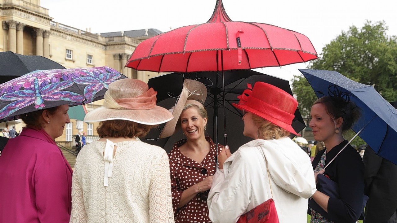 Guests attending a Garden Party at Buckingham Palace, central London.