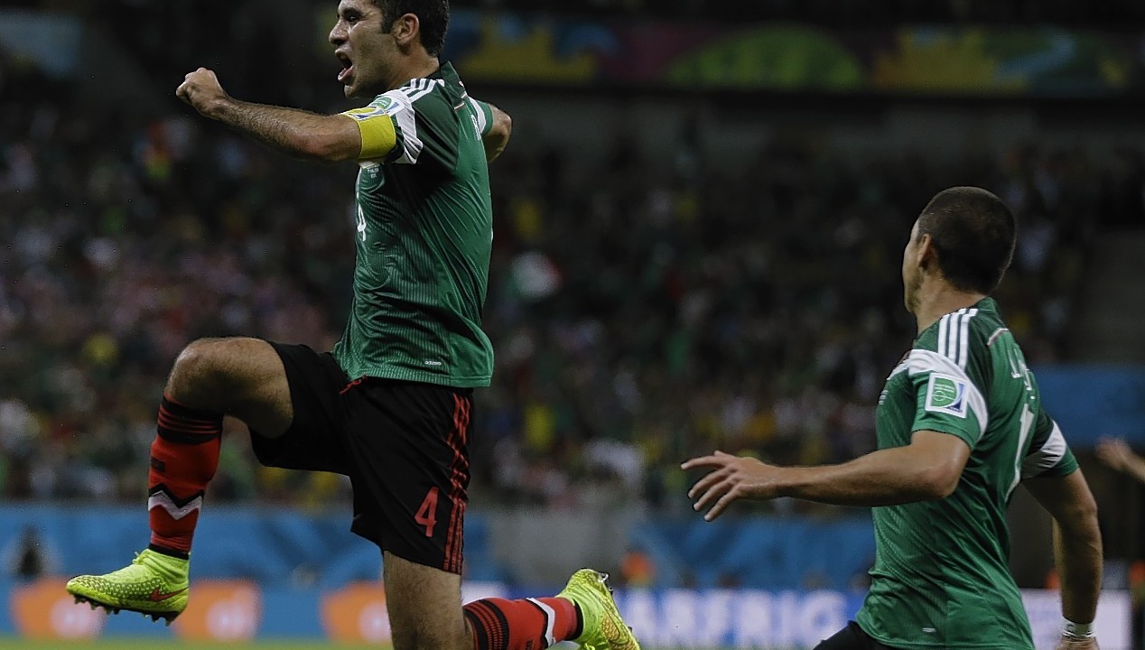 Mexico's Rafael Marquez celebrates after scoring  the first goal of his team during the group A World Cup soccer match between Croatia and Mexico at the Arena Pernambuco in Recife