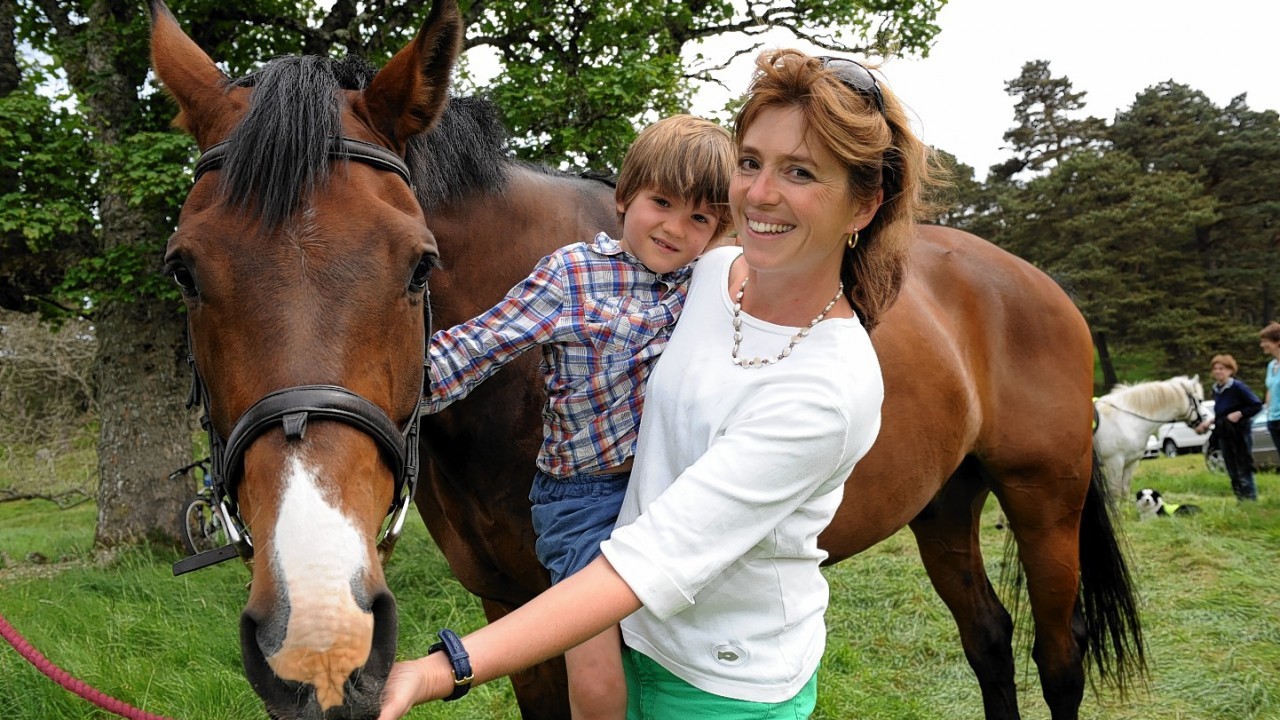 Annabelle Carey and son Fynn, 6, with horse Lincoln - who starred in Steven Spielberg's blockbuster War Horse.