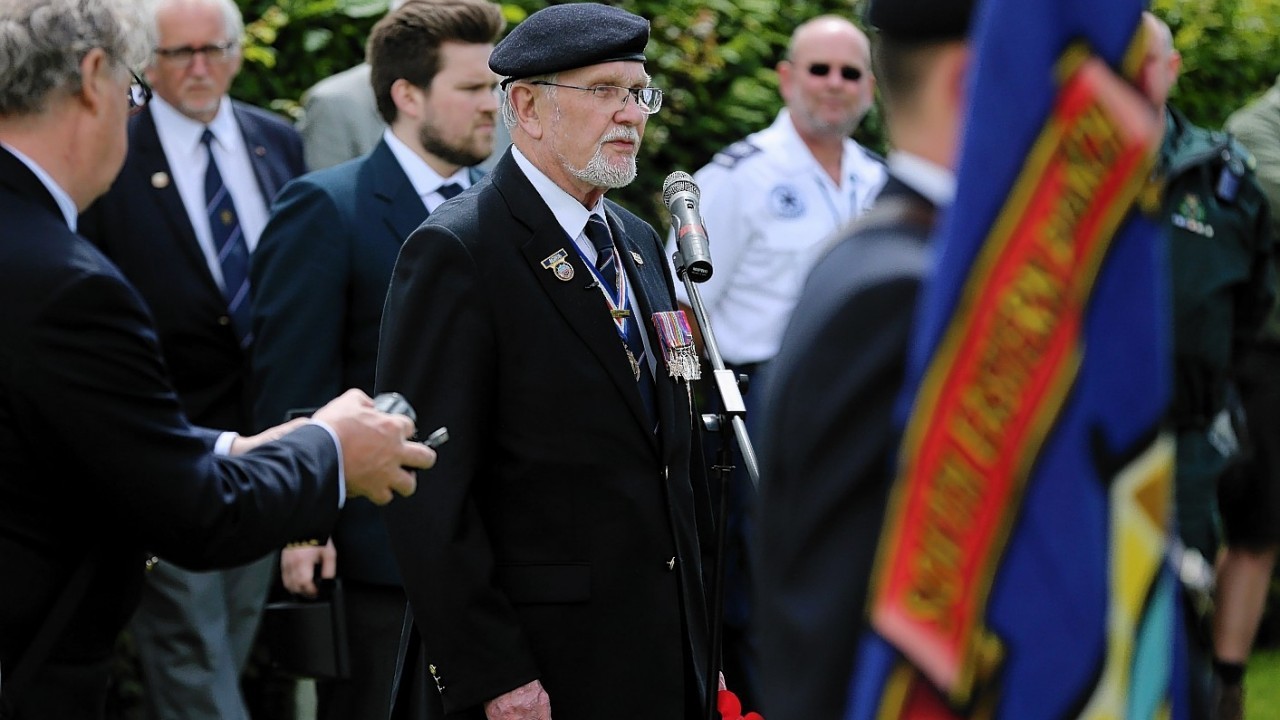 George Batts, National Secretary of the Normandy Veterans Association, makes a speech at Jerusalem Cemetery in Chouain, France, during a commemorative ceremony to mark 70th anniversary of the D-Day landings during World War II.