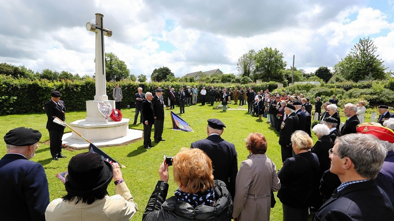 Members of the Normandy Veterans Association take part in a commemorative ceremony at Jerusalem Cemetery in Chouain, France, to mark 70th anniversary of the D-Day landings during World War II.
