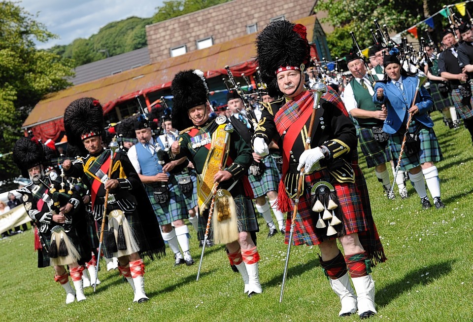 Massed pipe bands at Oldmeldrum Sports and Highland Games