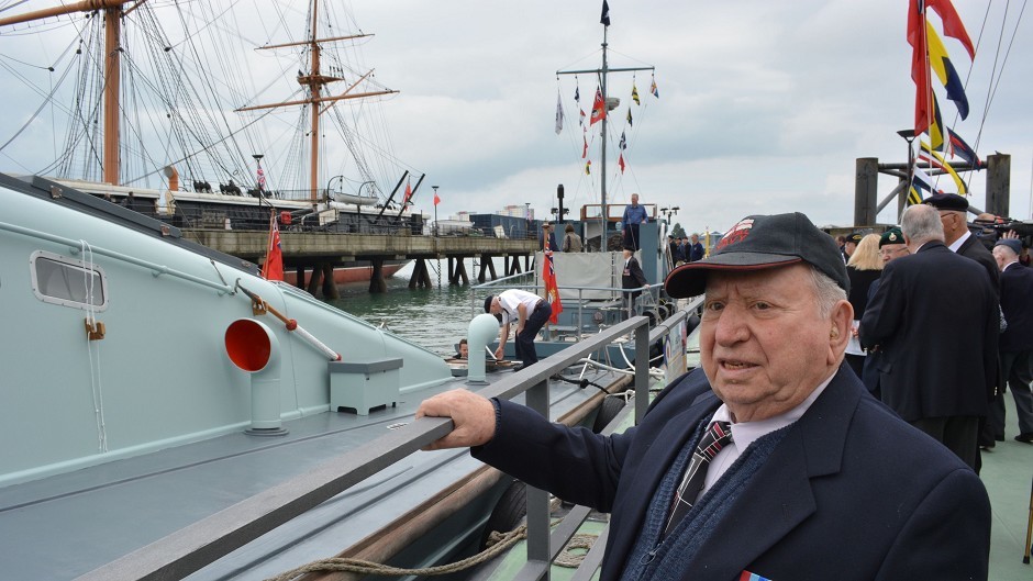 Basil Woolf, 91, from Dunedin, Florida, looks at the MGB81 which took part in the D-Day landings carrying British and Canadian troops to Sword Beach, during a visit to Portsmouth Historic Dockyard