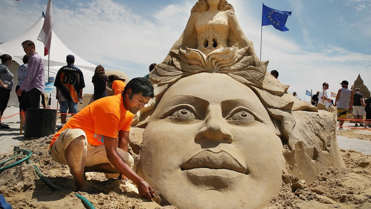 Sculptor Sudarsan Pattnaik, of India, works on his sculpture during the final day of the DO AC Sand Sculpting World Cup competition on the beach at Pennsylvania Avenue in Atlantic City