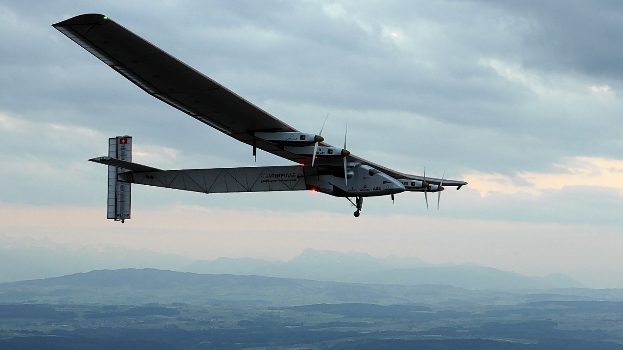 German test pilot Markus Scherdel steers the solar-powered Solar Impulse 2 aircraft for its maiden flight at its base in Payerne, Switzerland