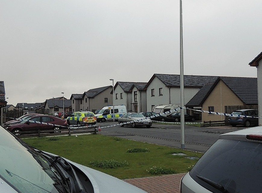 Police at the scene of the incident on Alba Road, Buckpool
