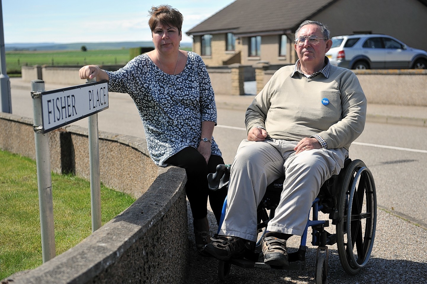 Gillian Priestley, left, and Robbie Murdoch, right, in Fisher Place, Lossiemouth which is possibly set to change from a cul-de-sac to a major thouroghfare to a new housing development