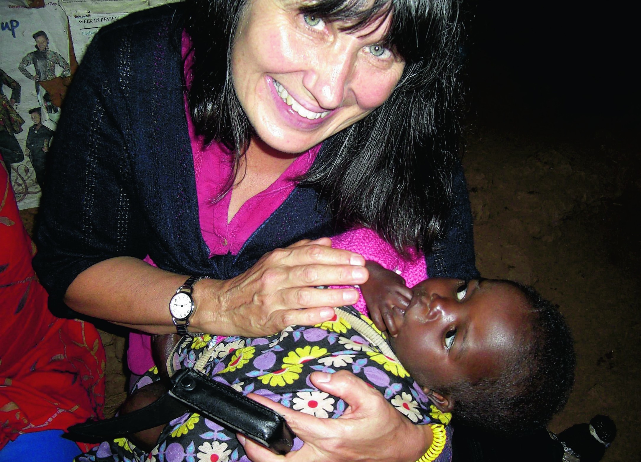 Aberdeen University graduate Dr Susan Wilson MBE with young orphan Jaffary