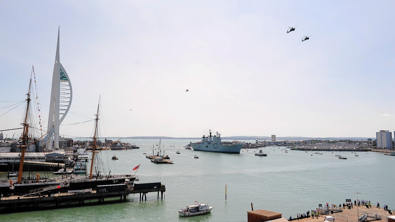 HMS Illustrious sails into her home port of Portsmouth for the final time ahead of being retired next month