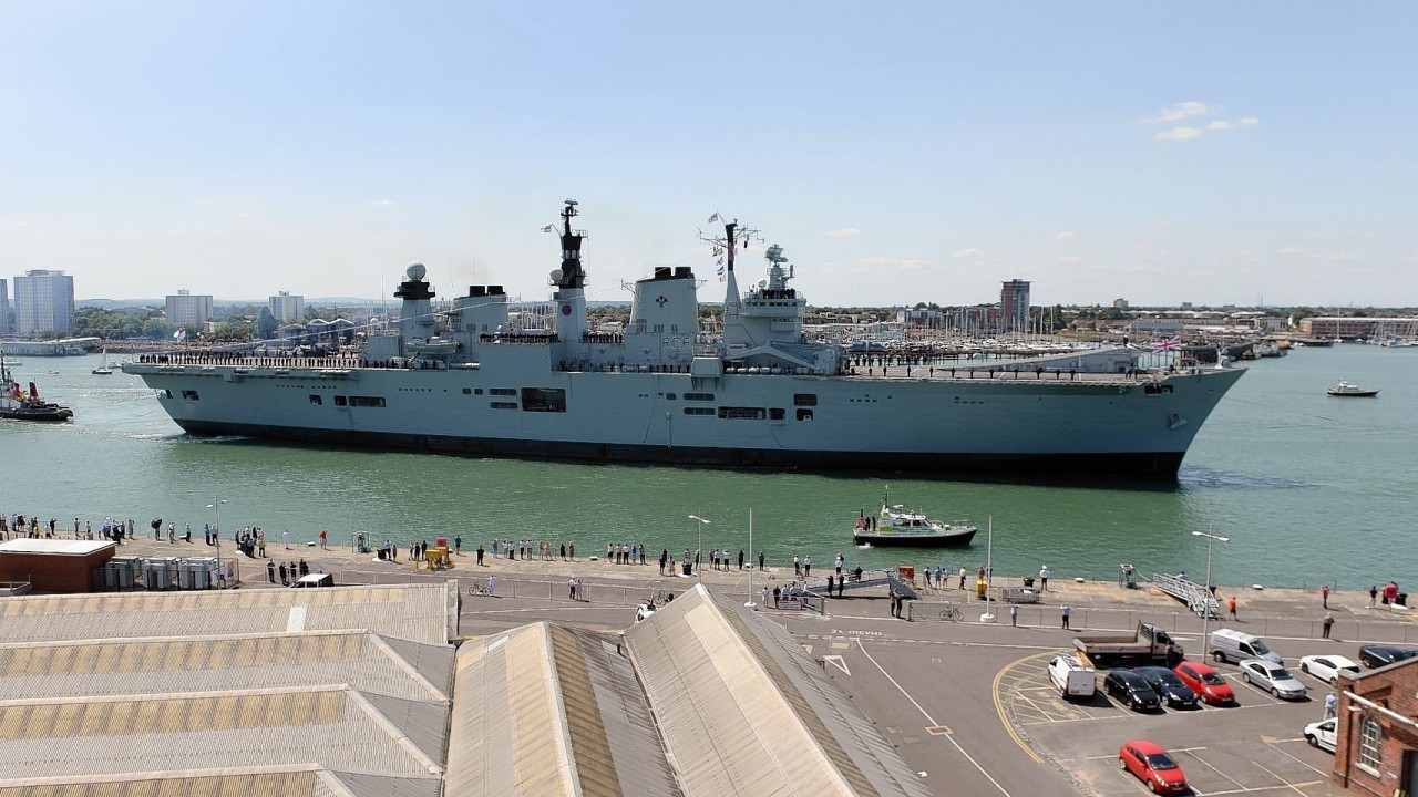 HMS Illustrious sails into her home port of Portsmouth for the final time ahead of being retired next month