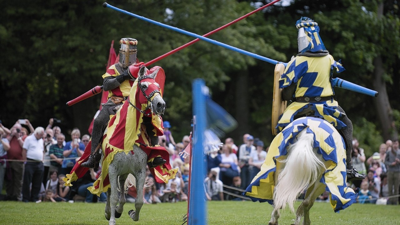 Knights on horseback compete to be crowned champion at Linlightgow Palace's medieval jousting tournament today. Credit: Jane Barlow