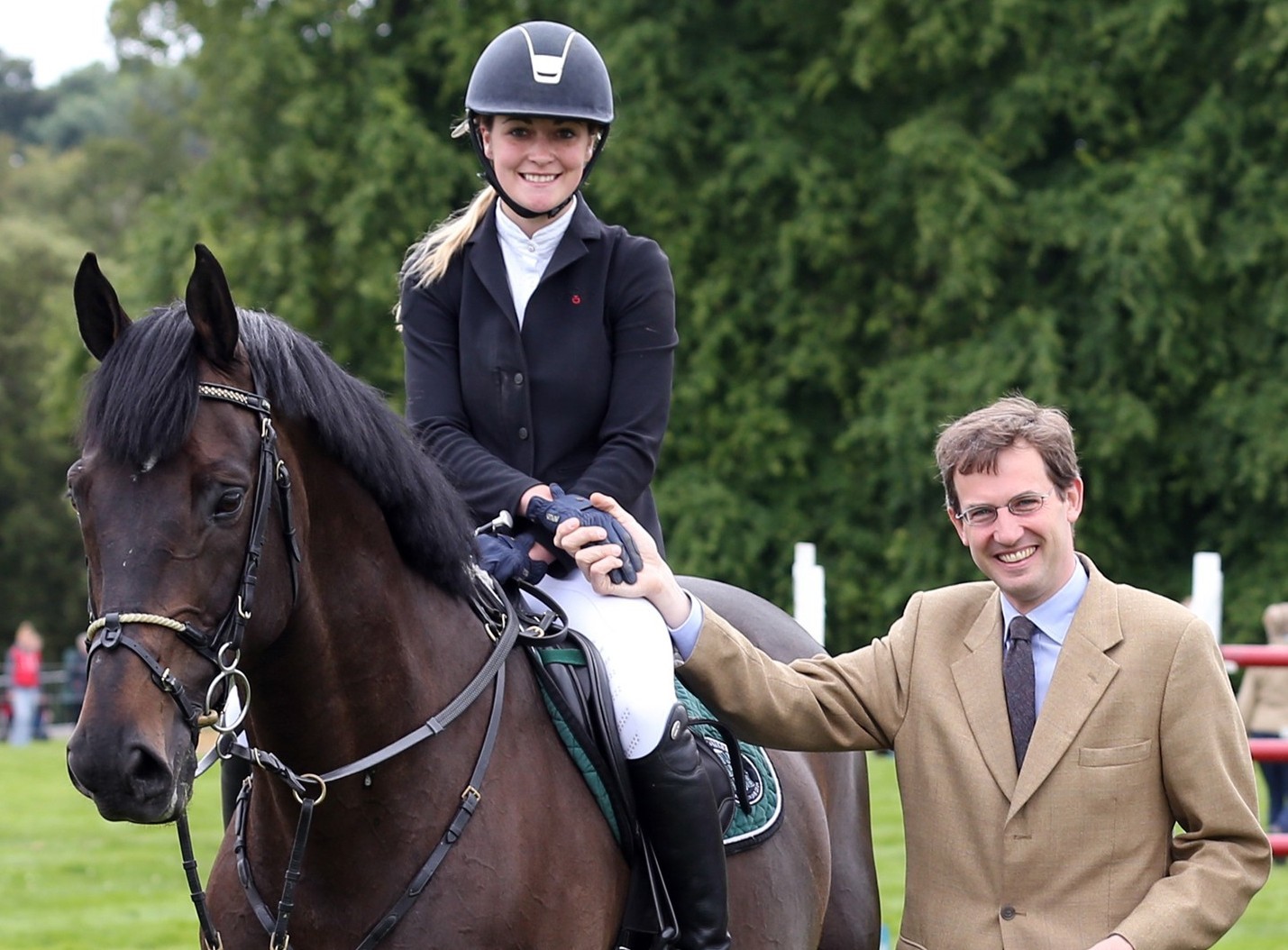 Lucy Guild being presented 1st Prize and the red rossette by Lord Hopetoun after winning the  the show jumping grand prix at Hopetoun Intenational Horse Trials on her horse Titi D’Oase