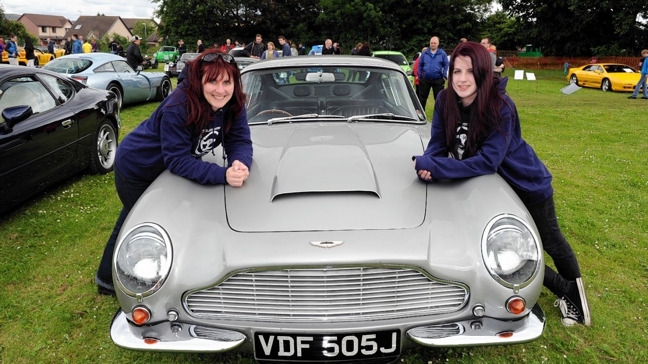 Nicky and Laura Anderson with their Aston Martin DB6 mk2