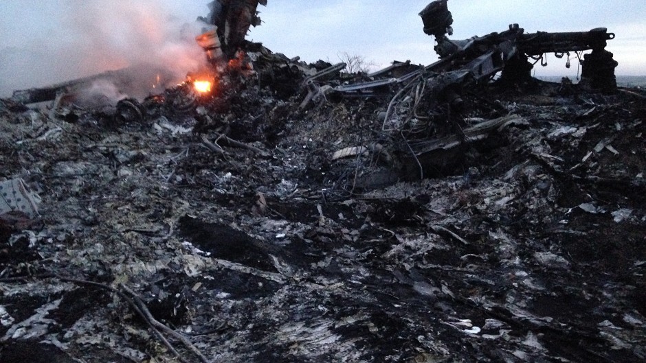 Smoke rises up at a crash site of a passenger plane, near the village of Grabovo, Ukraine (AP)