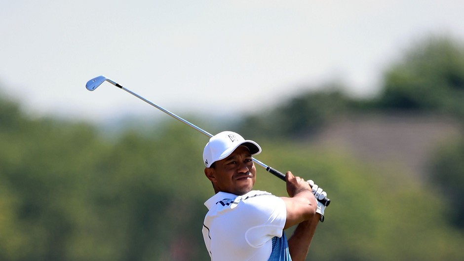 Tiger Woods took advantage of good scoring conditions to shoot a three-under 69 on the first day of the 143rd Open Championship at Royal Liverpool
