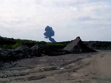 Smoke rises up at a crash site of a passenger plane, near the village of Grabovo, Ukraine (AP)