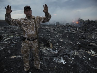 Smoke rises up at a crash site of a passenger plane, near the village of Grabovo, Ukraine (AP)